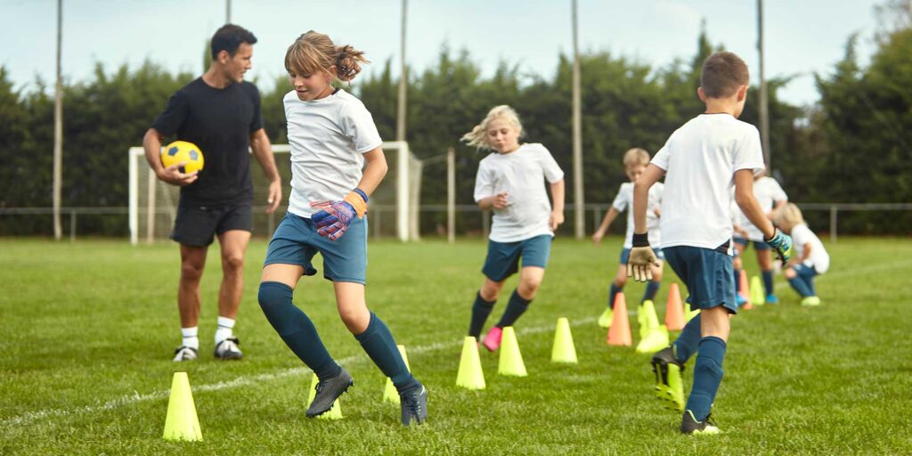 Children playing sport at school